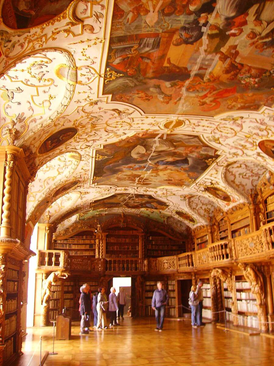 Waldsassen Abbey library with ornate wood carvings and painted ceiling